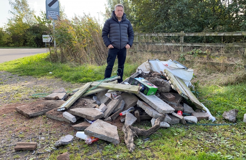 Councillor Angus Forbes beside the fly-tipping near Inchture