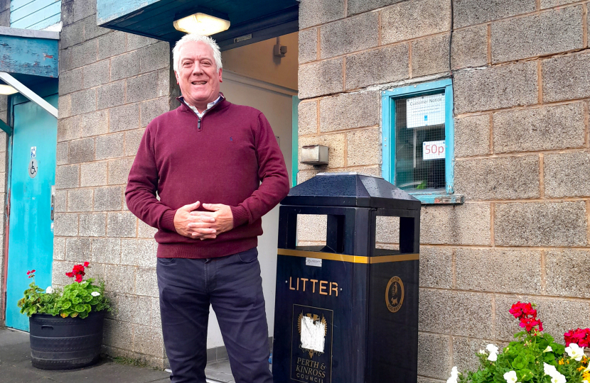 Councillor Keith Allan beside the public toilets in Auchterarder 