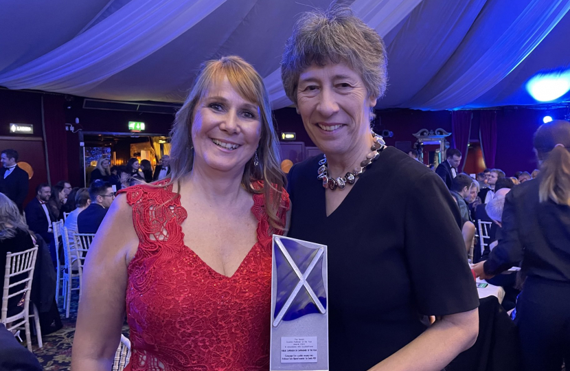 Jules Rose and Liz Smith MSP with their award
