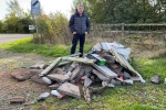 Councillor Angus Forbes beside the fly-tipping near Inchture