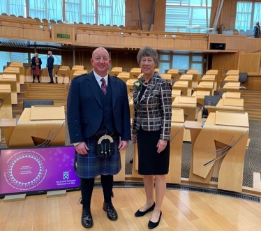 Local Hero Robert Allan with Liz Smith MSP at Opening of Scottish Parliament 2021