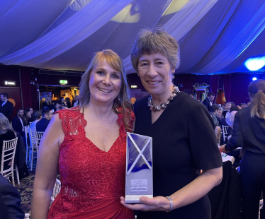 Jules Rose and Liz Smith MSP with their award